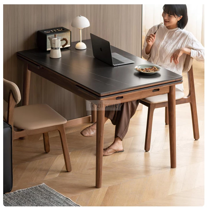 Bàn Ăn Gấp Gọn Thông Minh Gỗ Tự Nhiên Mặt Đá Togismart BA0212 thiết kế hiện đại, nhỏ gọn, dễ dàng mở rộng khi cần. Chất liệu gỗ tự nhiên bền chắc kết hợp mặt đá sang trọng, chống trầy xước, dễ vệ sinh. Giải pháp hoàn hảo giúp tối ưu diện tích và nâng tầm không gian sống.