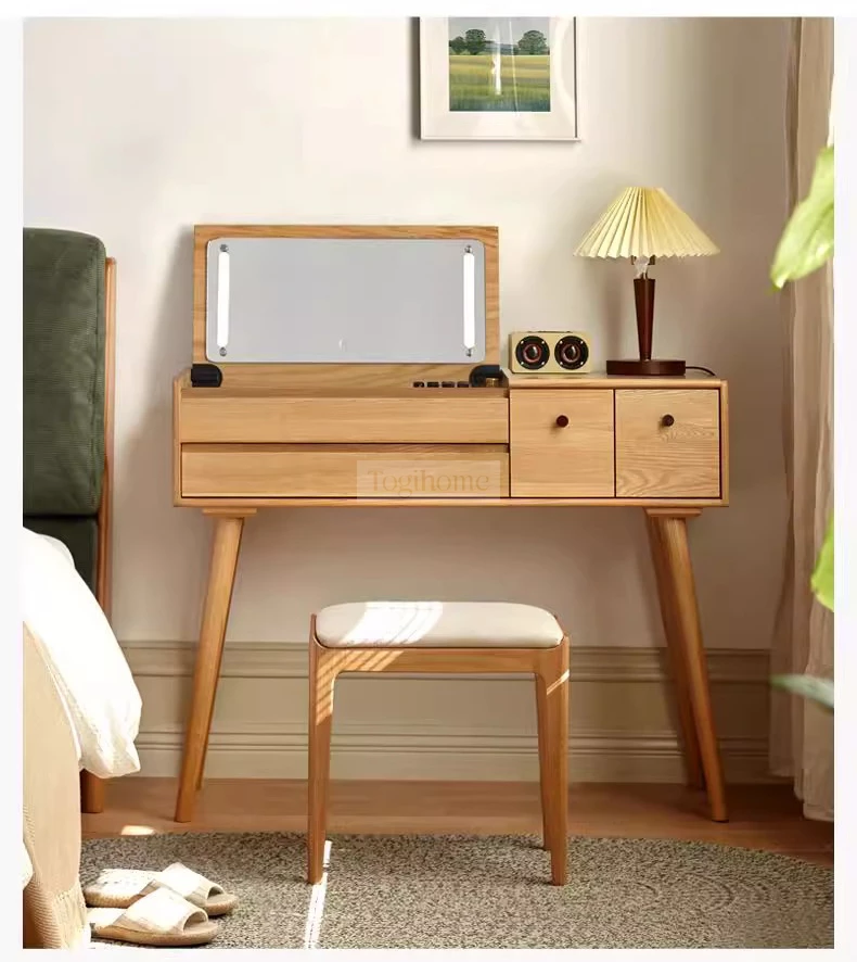 Bàn Trang Điểm Gỗ Tự Nhiên Phong Cách Hiện Đại Togismart TDM153 mang thiết kế tinh tế, sang trọng, phù hợp phòng ngủ trẻ trung. Chất liệu gỗ tự nhiên bền chắc, chống cong vênh, kết hợp gương và ngăn kéo tiện dụng, giúp sắp xếp gọn gàng và tạo điểm nhấn đẳng cấp cho không gian.